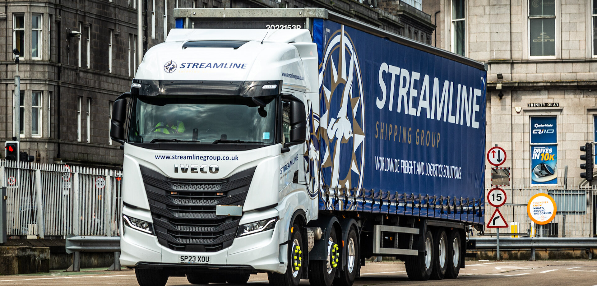 streamline lorry travelling on the road