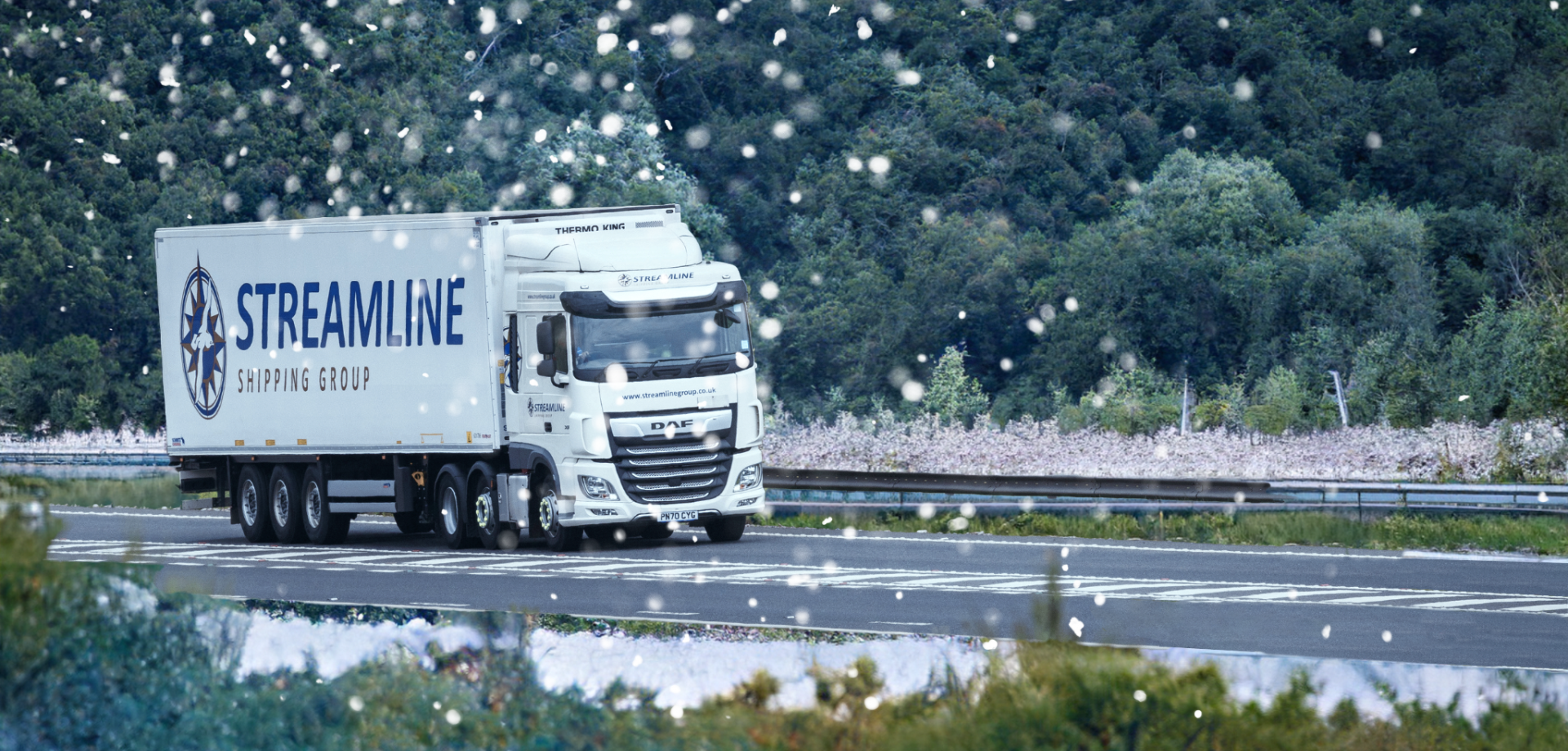 Streamline shipping lorry on dual carriageway - christmas theme