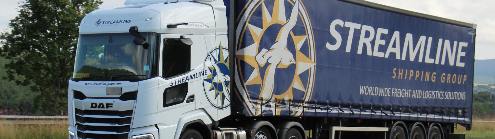 Streamline pallet delivery truck leaving a regional depot, part of the UK pallet distribution