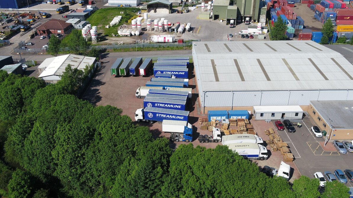 Streamline pallets at a depot hub, showing how the pallet network consolidates freight efficiently.